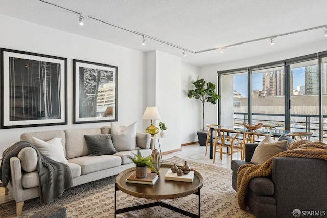 living room with light tile patterned floors and a textured ceiling