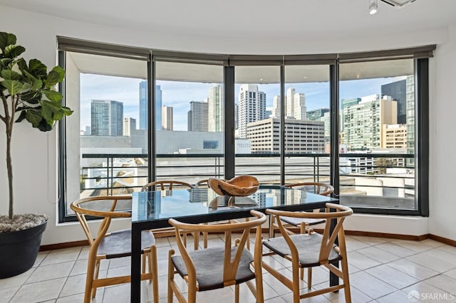 dining area with light tile patterned floors