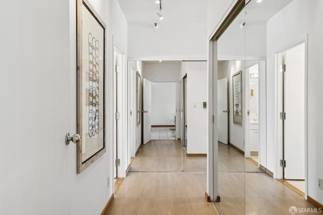 corridor featuring light wood-type flooring