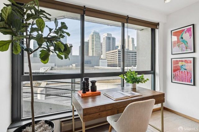 office with light hardwood / wood-style flooring