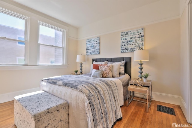 bedroom featuring wood-type flooring