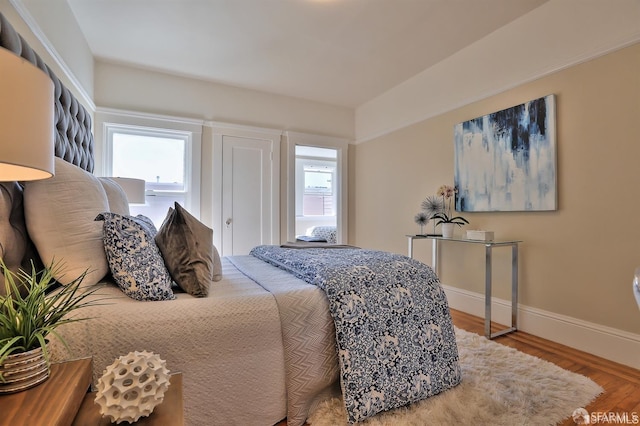 bedroom with hardwood / wood-style flooring