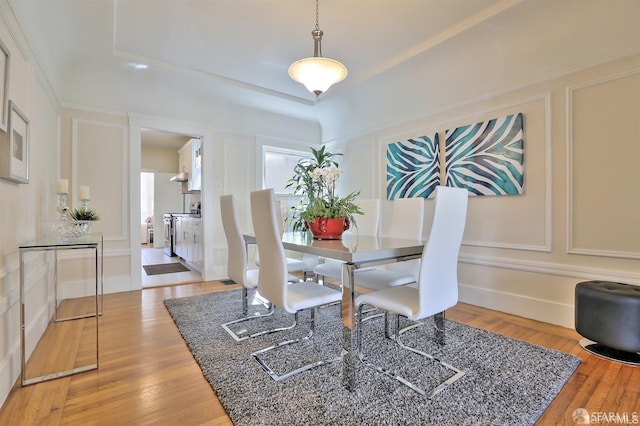 dining area with hardwood / wood-style floors