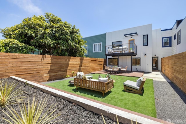 738 Athens St, San Francisco, CA 94112 - fenced backyard featuring a balcony and outdoor lounge area