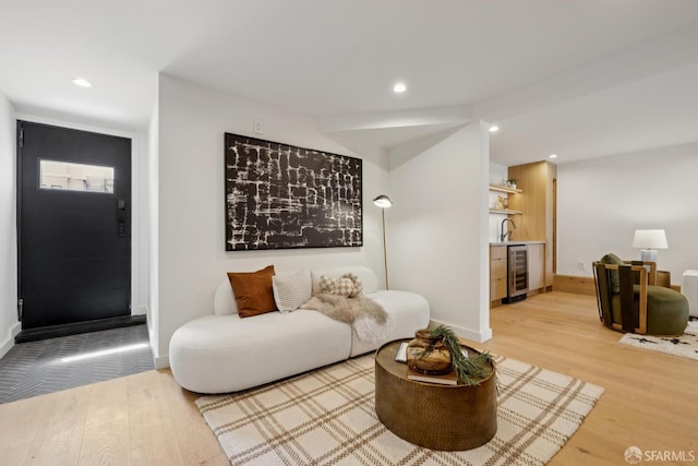 738 Athens St, San Francisco, CA 94112 - living room with wine cooler, light wood-style flooring, bar area, and recessed lighting