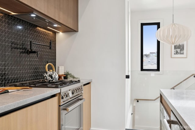 738 Athens St, San Francisco, CA 94112 - kitchen featuring stainless steel range, backsplash, light countertops, and modern cabinets