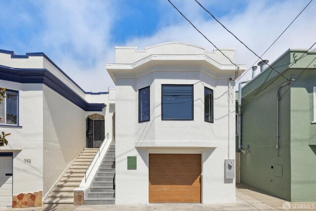 738 Athens St, San Francisco, CA 94112 - view of front of property featuring stucco siding and a garage