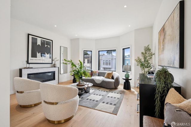 738 Athens St, San Francisco, CA 94112 - living room with light wood-style floors, recessed lighting, and a glass covered fireplace