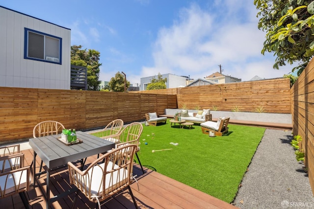 738 Athens St, San Francisco, CA 94112 - fenced backyard featuring outdoor dining space, a wooden deck, and an outdoor hangout area