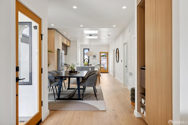 738 Athens St, San Francisco, CA 94112 - dining area featuring light wood-type flooring, recessed lighting, and a skylight