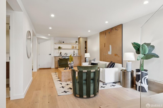 738 Athens St, San Francisco, CA 94112 - living area featuring light wood-style floors, recessed lighting, and bar
