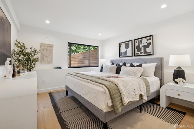 738 Athens St, San Francisco, CA 94112 - bedroom with wood finished floors and recessed lighting