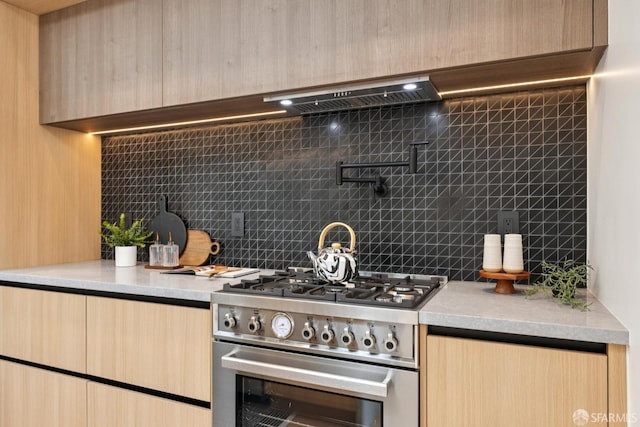 738 Athens St, San Francisco, CA 94112 - kitchen featuring high end stainless steel range oven, light brown cabinets, backsplash, and light countertops