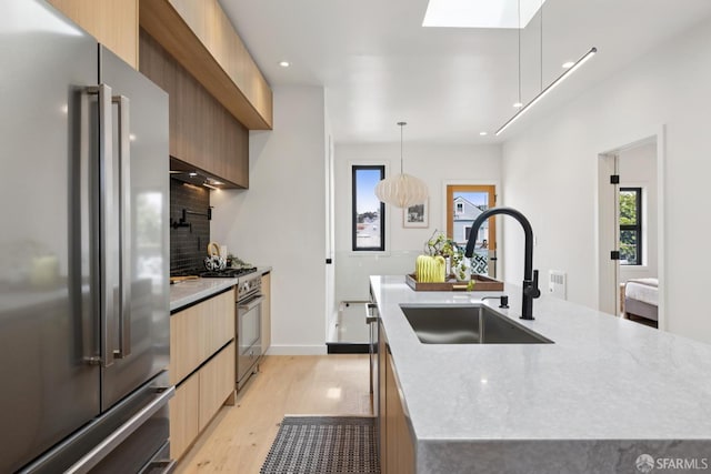 738 Athens St, San Francisco, CA 94112 - kitchen with premium appliances, modern cabinets, light wood-style floors, decorative backsplash, and recessed lighting