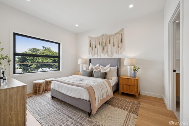 738 Athens St, San Francisco, CA 94112 - bedroom with light wood-style flooring and recessed lighting
