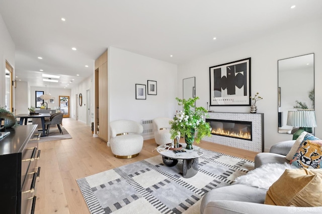 738 Athens St, San Francisco, CA 94112 - living room with a glass covered fireplace, recessed lighting, and light wood-type flooring