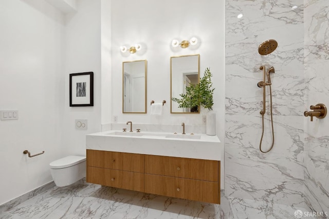 bathroom featuring tiled shower, toilet, and vanity