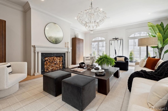 living room featuring ornamental molding, an inviting chandelier, and a premium fireplace