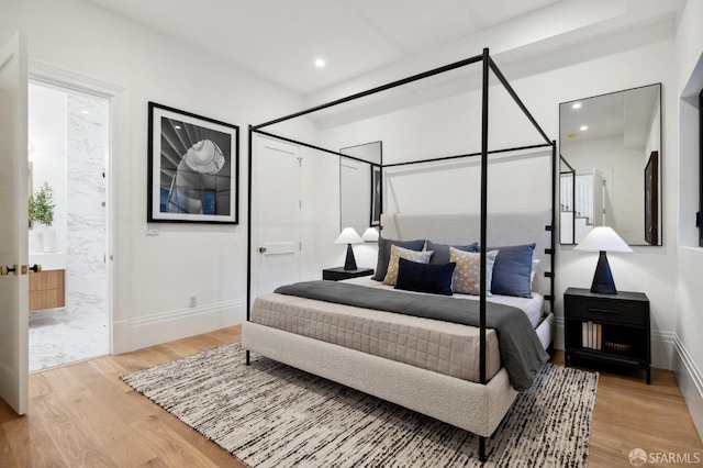 bedroom with light wood-type flooring