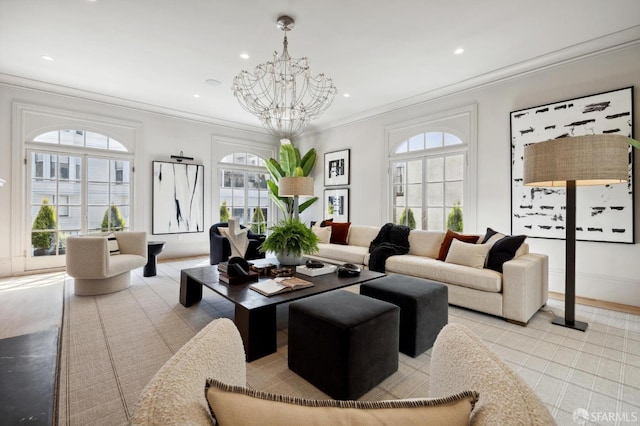 living room with ornamental molding and a chandelier