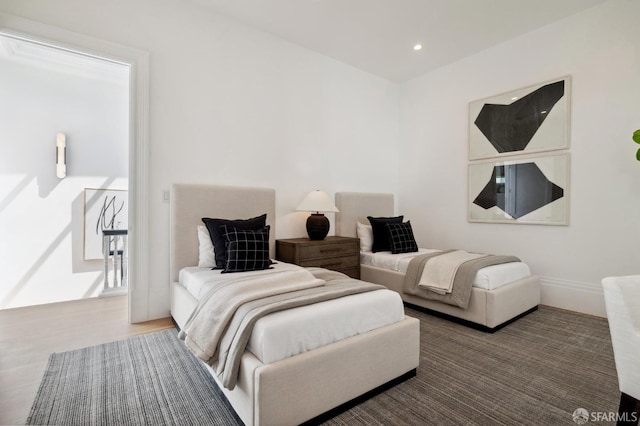 bedroom with hardwood / wood-style flooring