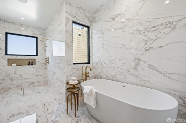 bathroom featuring tile walls and a bathing tub