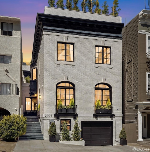 view of front of property featuring a garage