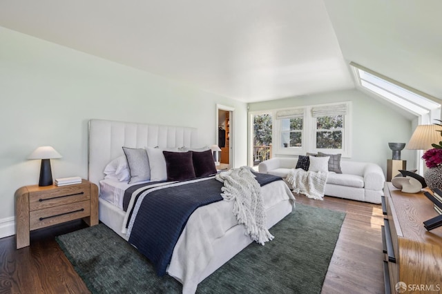 318 Caselli Ave, San Francisco, CA 94114 - bedroom featuring dark wood-style floors, a skylight, vaulted ceiling, and a walk in closet