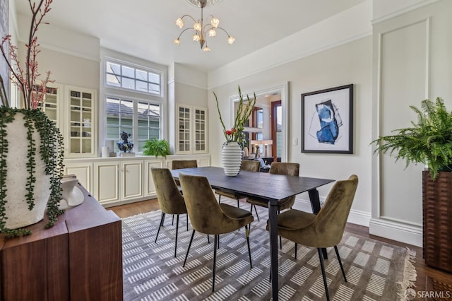 318 Caselli Ave, San Francisco, CA 94114 - dining room with a chandelier, wood finished floors, and baseboards