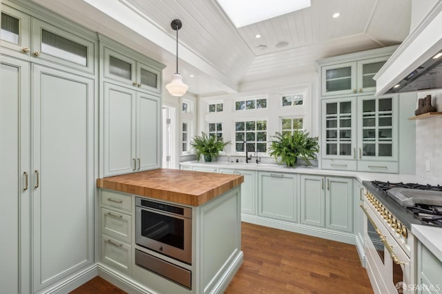 318 Caselli Ave, San Francisco, CA 94114 - kitchen featuring butcher block counters, premium range hood, decorative light fixtures, wooden ceiling, and dark wood finished floors