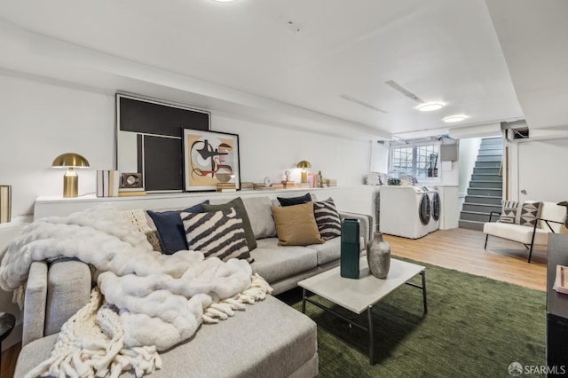 318 Caselli Ave, San Francisco, CA 94114 - living room featuring washing machine and dryer, stairs, and wood finished floors