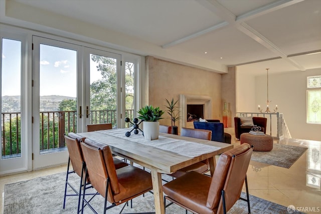 tiled dining area featuring beamed ceiling, coffered ceiling, a notable chandelier, and french doors