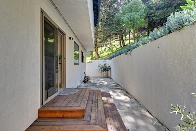 wooden deck with a patio area