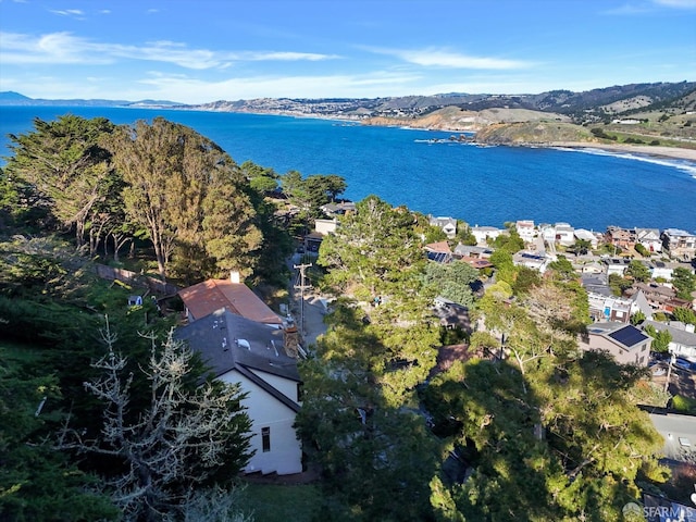 aerial view featuring a water and mountain view