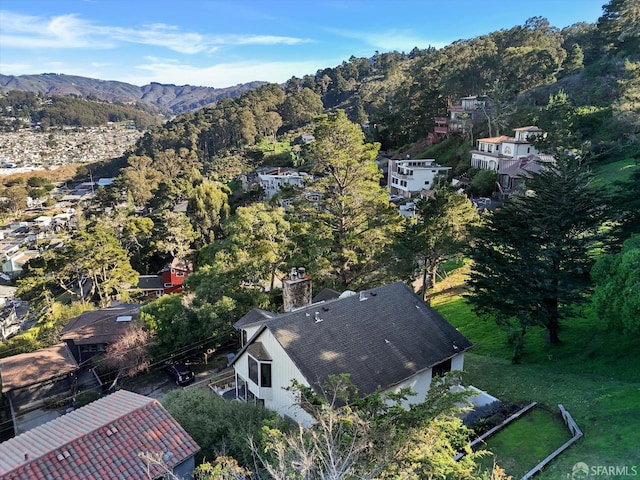 birds eye view of property with a mountain view