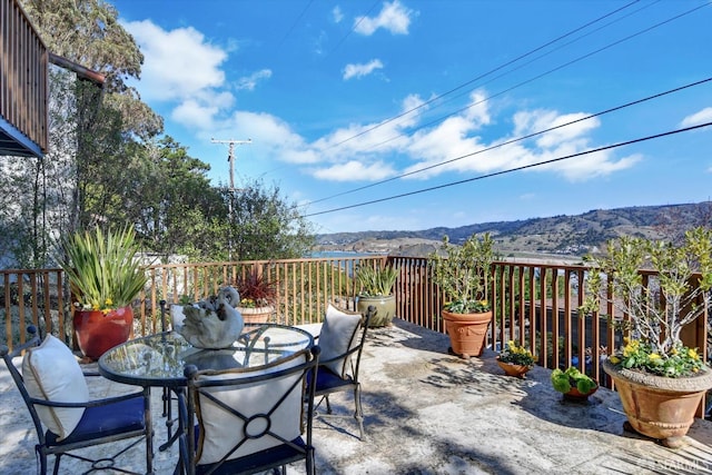 view of patio / terrace featuring a mountain view