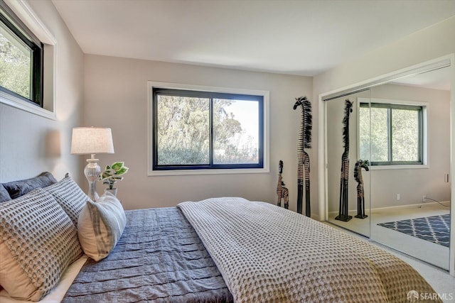 bedroom with carpet flooring and a closet