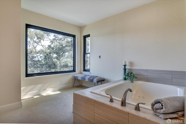 bathroom with tiled tub