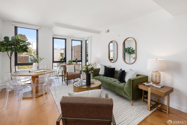 300 Ivy St Unit 401, San Francisco, CA 94102 - living room with visible vents, baseboards, and light wood-style flooring
