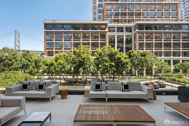 view of community with outdoor lounge area and a patio