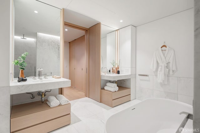 bathroom featuring vanity and a bathing tub