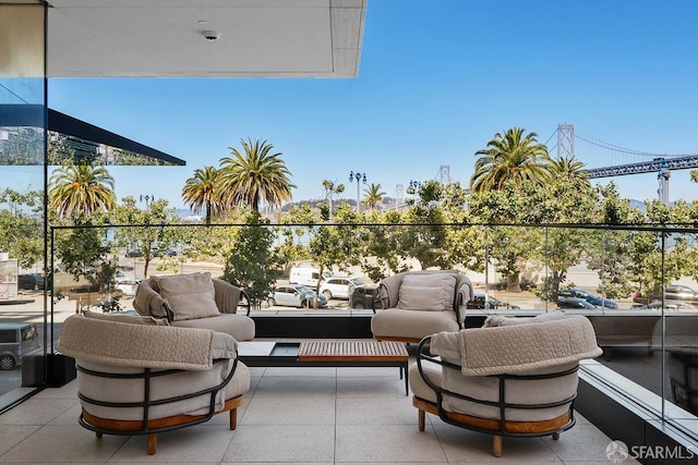 view of patio with a balcony and an outdoor hangout area