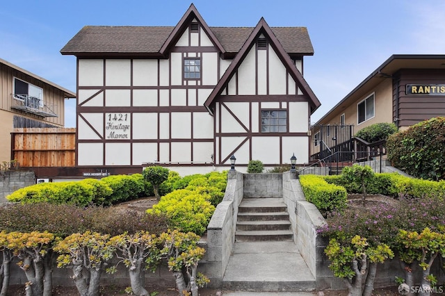 1421 El Camino Real Unit 3, Burlingame, CA 94010 - rear view of house with stairs, stucco siding, and a shingled roof