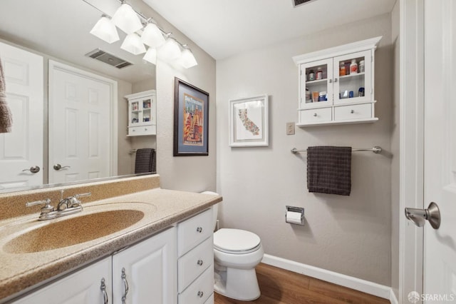 1421 El Camino Real Unit 3, Burlingame, CA 94010 - bathroom with baseboards, wood finished floors, vanity, and toilet