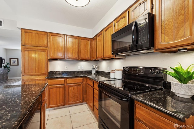 1421 El Camino Real Unit 3, Burlingame, CA 94010 - kitchen with black appliances, brown cabinetry, and dark stone countertops
