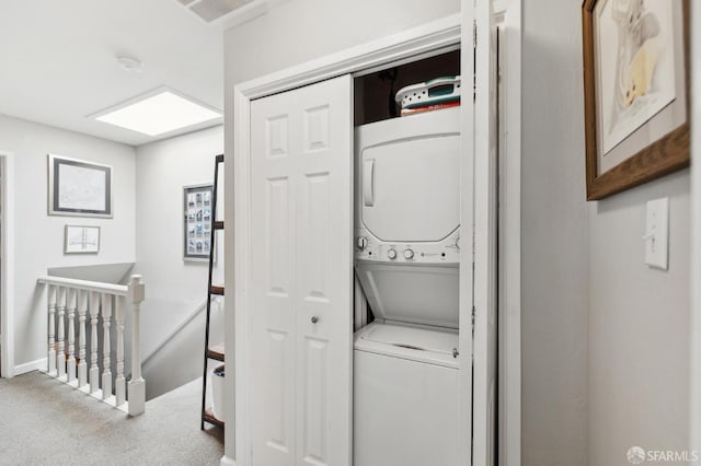 1421 El Camino Real Unit 3, Burlingame, CA 94010 - washroom featuring stacked washing machine and dryer, carpet, and baseboards