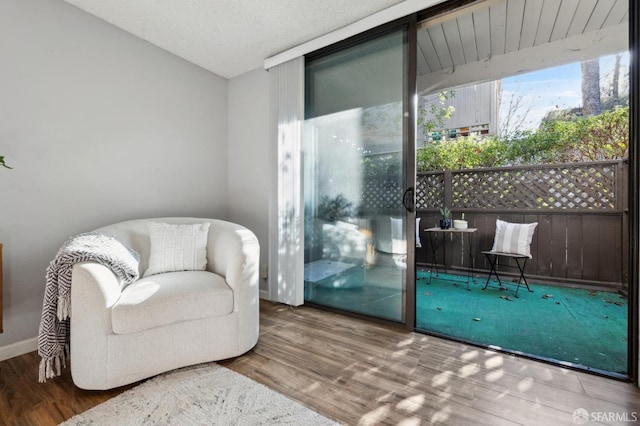 living area featuring hardwood / wood-style floors