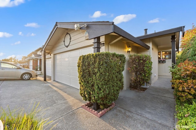 2811 Bayview Dr, Alameda, CA 94501 - view of side of property featuring asphalt driveway and an attached garage