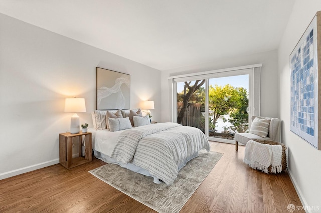 2811 Bayview Dr, Alameda, CA 94501 - bedroom with access to outside, light wood-style floors, and baseboards
