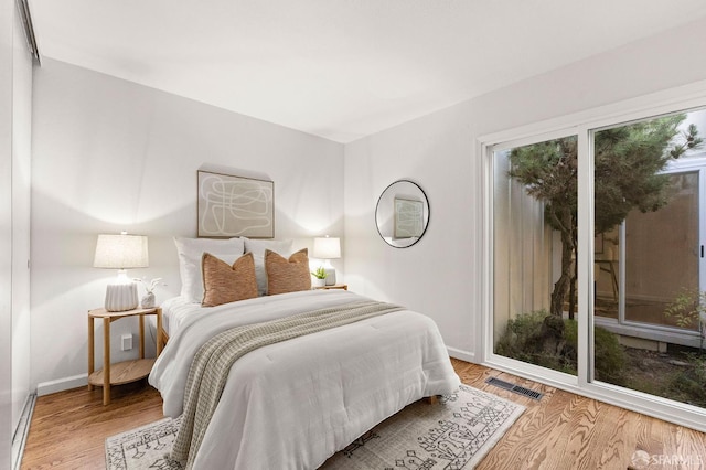 2811 Bayview Dr, Alameda, CA 94501 - bedroom with wood finished floors and baseboards